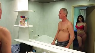 Busty young Goddess is bathing with an older man
